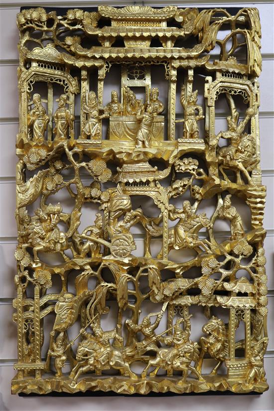 Six Chinese carved giltwood panels of soldiers amid pavilions